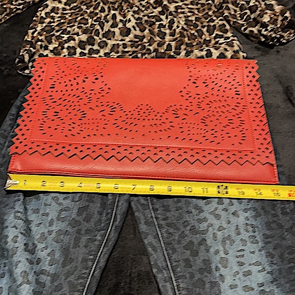 Large brick red laser-cut fold-over clutch